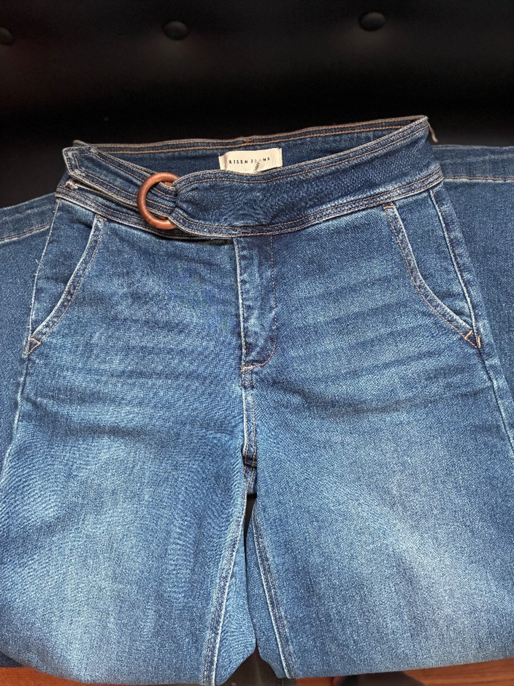 Risen wide leg Jeans with attached buckle accent.